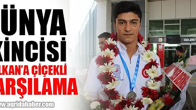 Dünya ikincisi Malkan'a, çiçekli karşılama